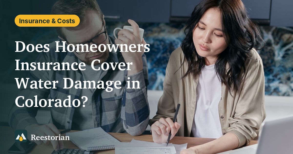 Homeowners reviewing paperwork at a table, about whether homeowners insurance covers water damage in Colorado