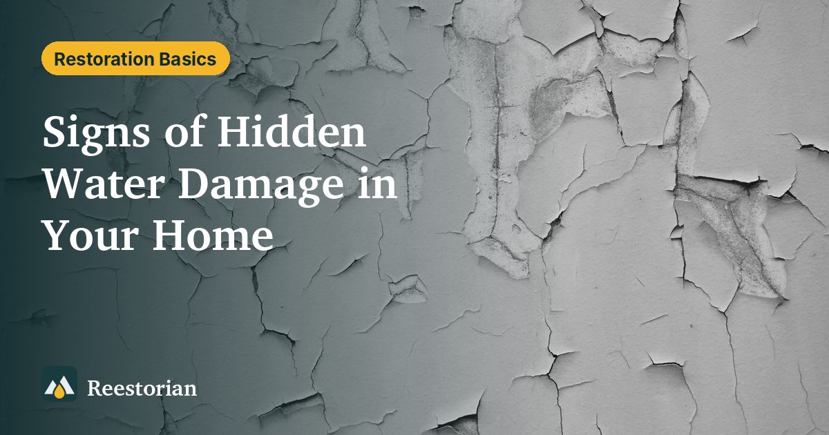 Cracked, peeling paint on a wall, one of the signs of hidden water damage